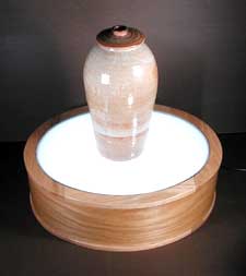 Photo of oval light box for
display of sculpture.